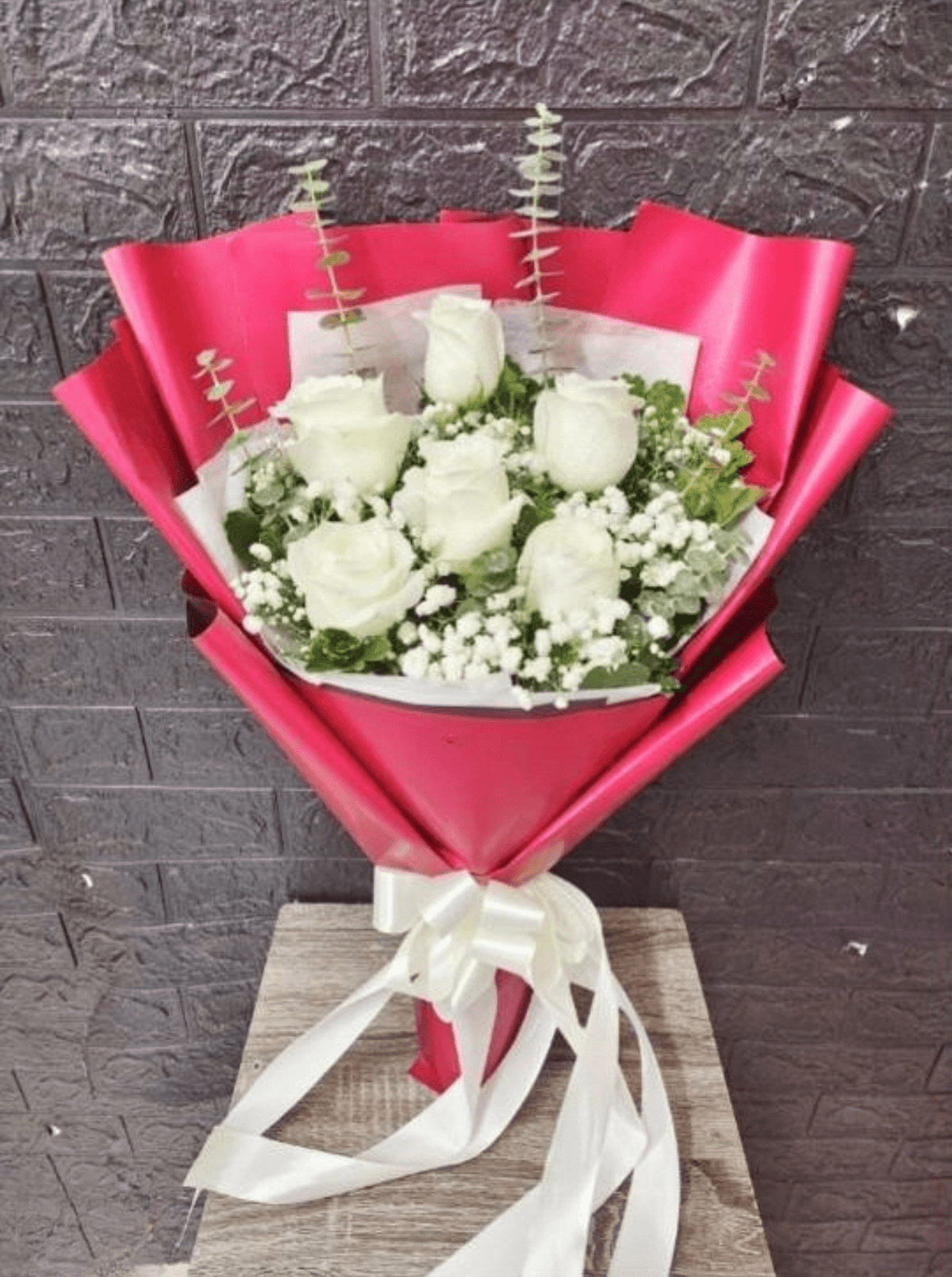 A soft, romantic bouquet featuring fresh roses surrounded by delicate filler flowers and seasonal greenery, arranged in a full, rounded shape. Finished with quality wrapping and a ribbon, it’s a timeless choice for birthdays, anniversaries, congratulations, or a gentle “thinking of you.”