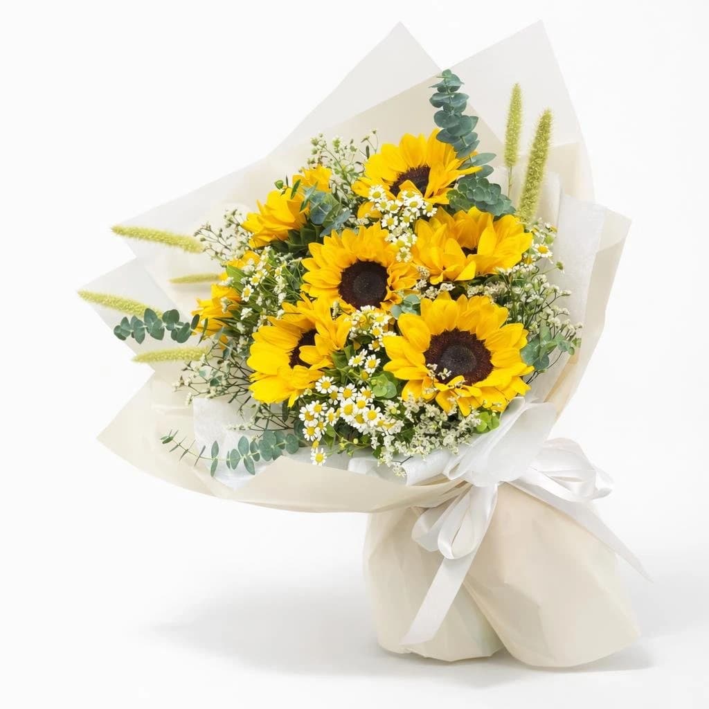 Sunny Sunflower Bouquet with Sunflowers, baby's breath, eucalyptus, fern, wrapped in kraft paper with ribbon.