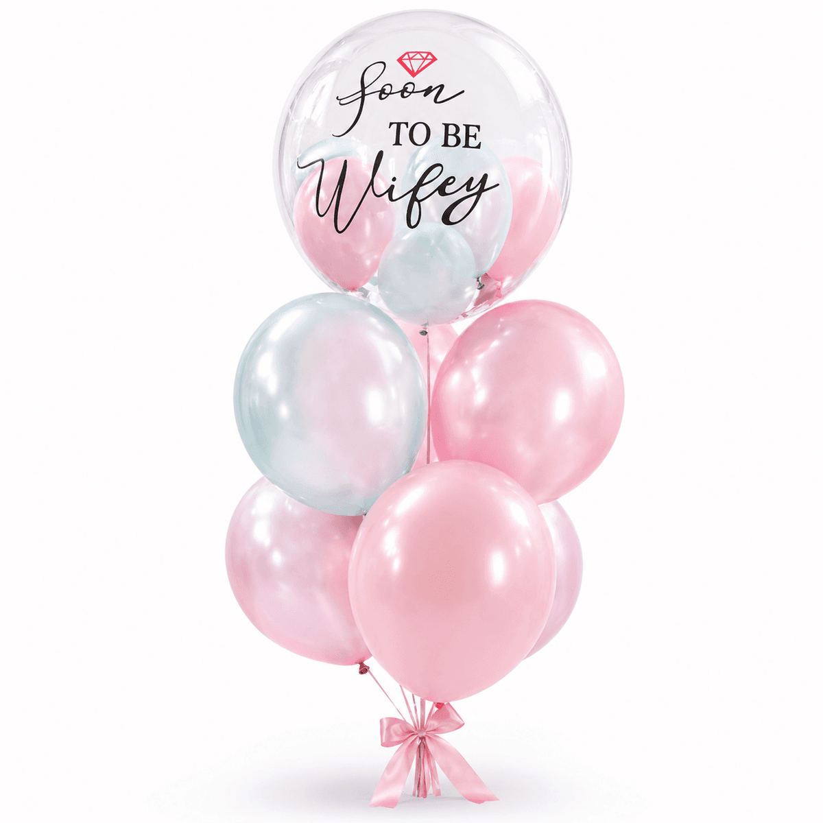A sweet pastel balloon set for bridal showers, engagement surprises, and pre-wedding celebrations. The design features a clear bubble balloon with “Soon To Be Wifey” lettering, soft pink and pastel blue balloons, and a pink ribbon bow at the base. Perfect for romantic surprises, proposal celebrations, bridal party decoration, and photo corners.