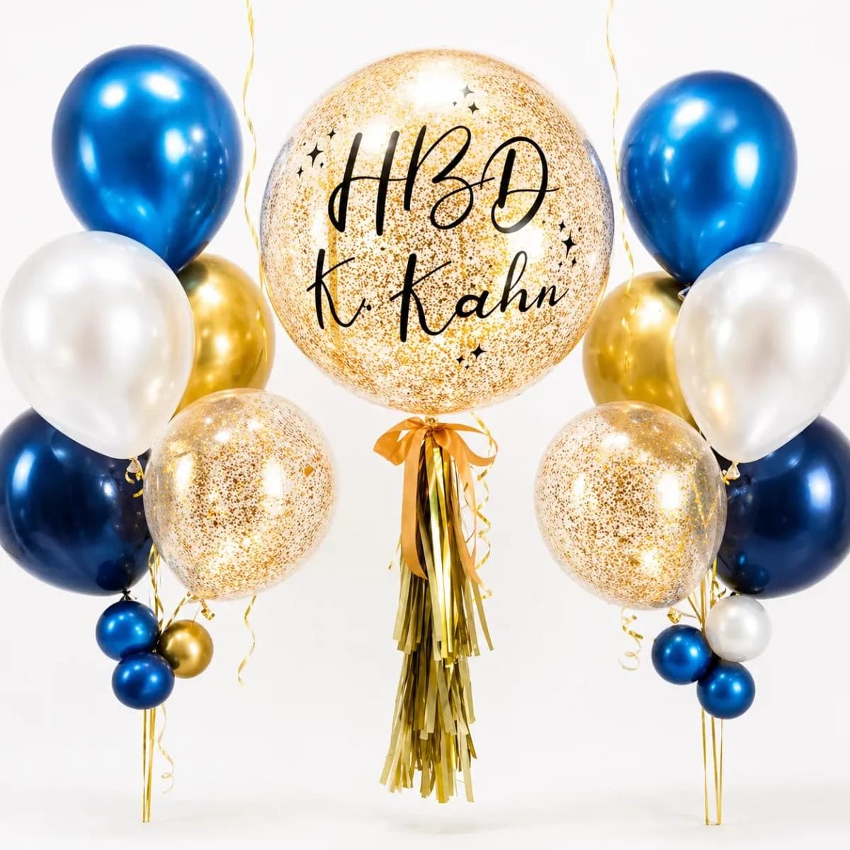 A fresh blue and white birthday balloon set with a large personalized birthday bubble balloon, silver glitter details, blue ribbon tassels, and matching balloon cluster. Perfect for birthday surprises, room decoration, photo corners, and gift delivery in Chiang Mai.