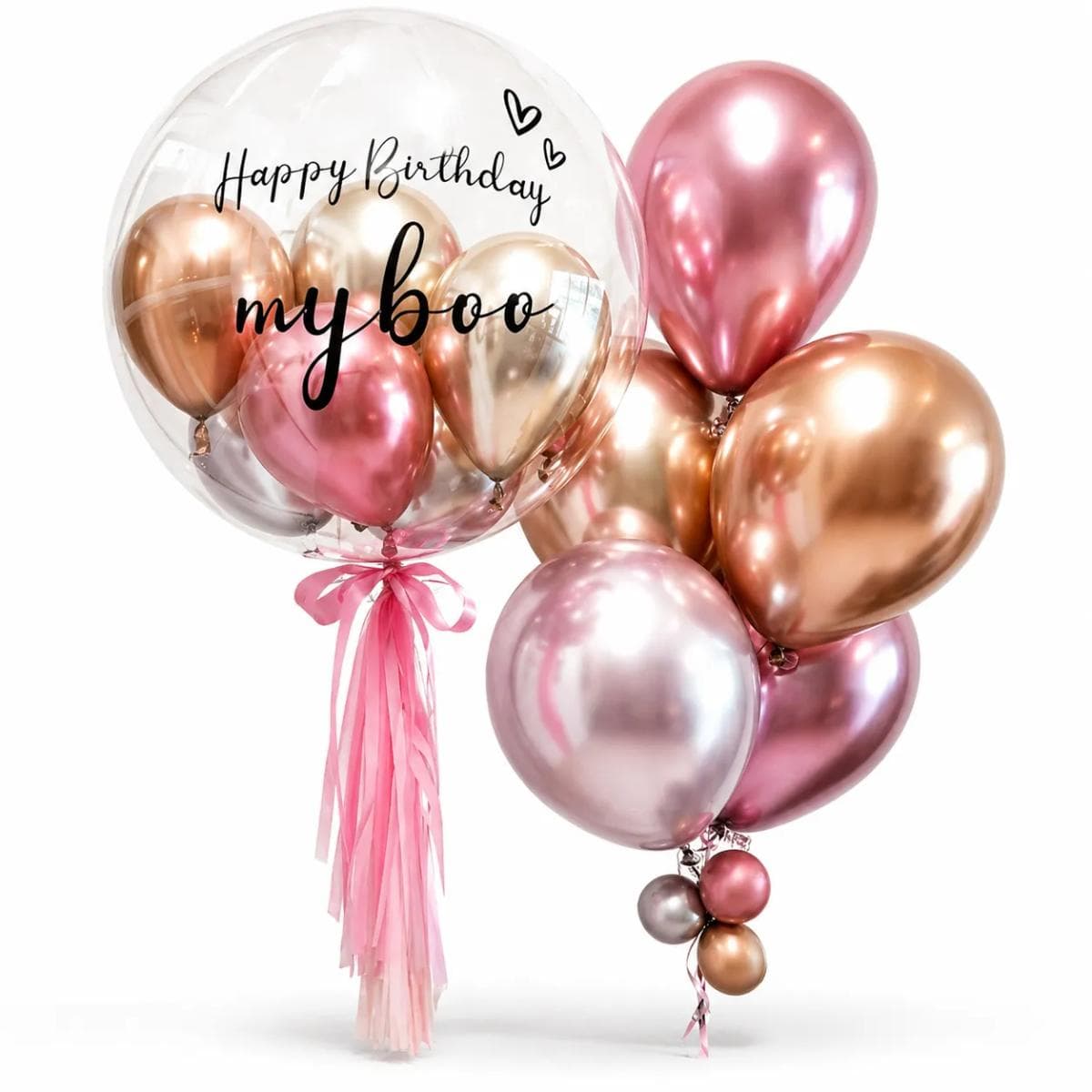 A stylish rose gold birthday balloon set with a large clear bubble balloon, mini metallic balloons inside, “Happy Birthday my boo” lettering, pink tassel ribbons, and a matching rose gold balloon cluster. Perfect for birthday surprises, romantic gifts, party decoration, hotel room setups, and celebration photo corners.