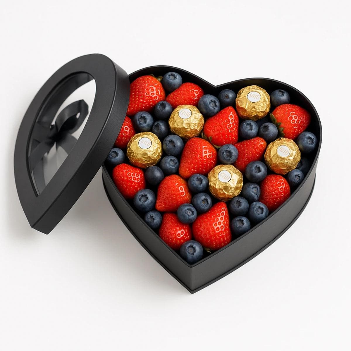 Heart-shaped box with strawberries and Ferrero chocolates.